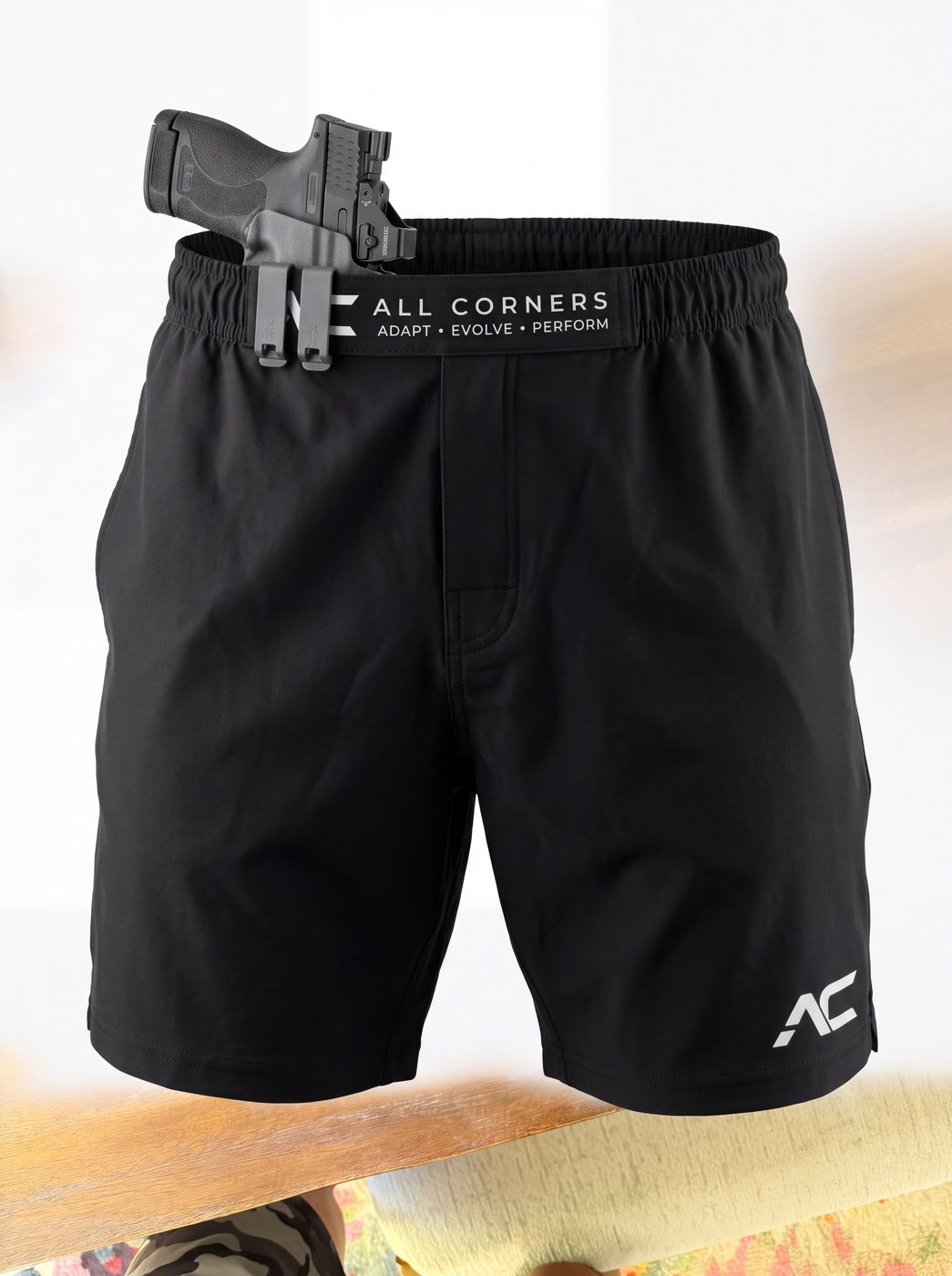 All Corners shorts with a holstered pistol on the retention waistband