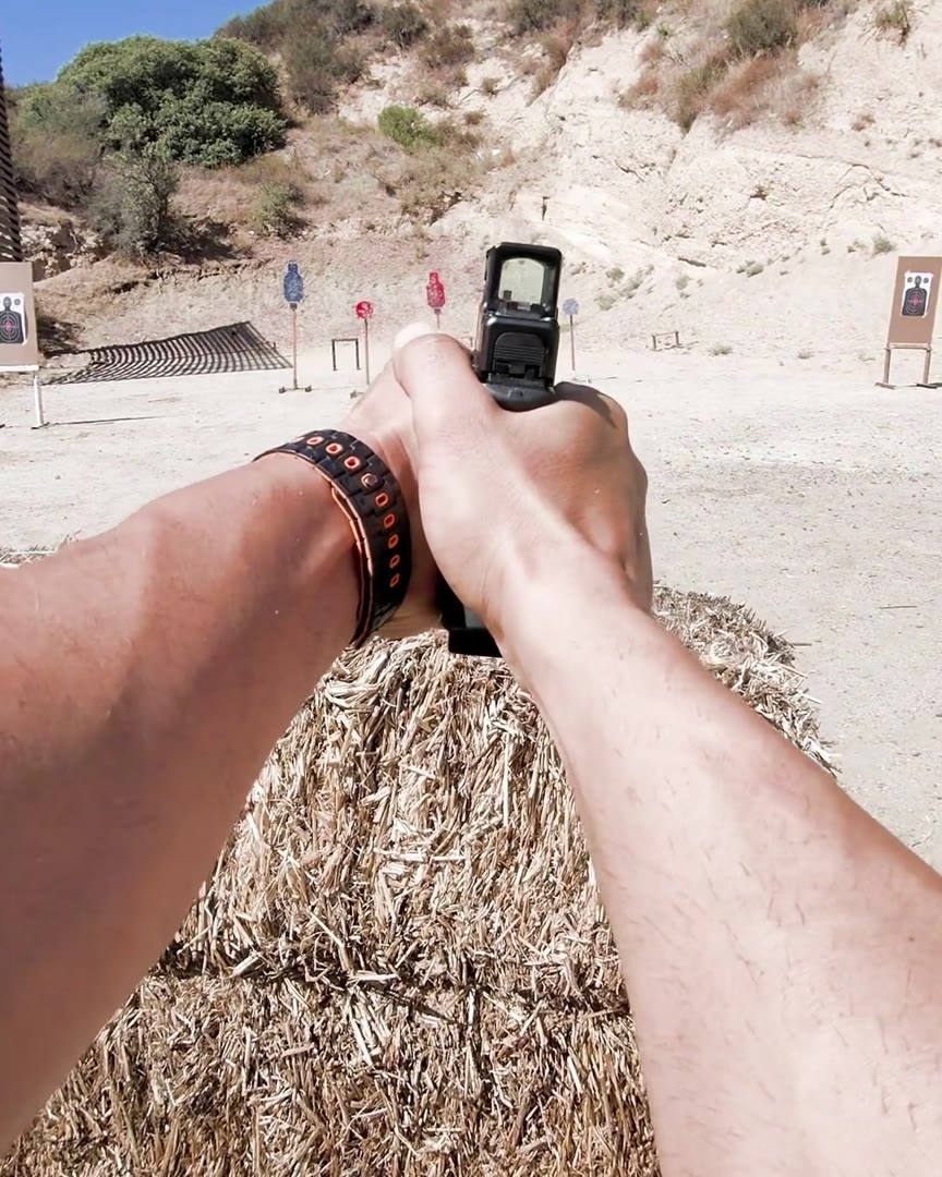 First-person view down a pistol at the range